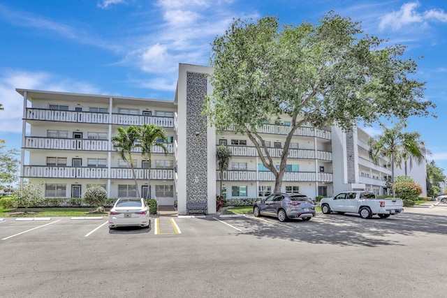 3034 Oakridge D 3034, Deerfield Beach, FL 33442 - view of building exterior featuring uncovered parking