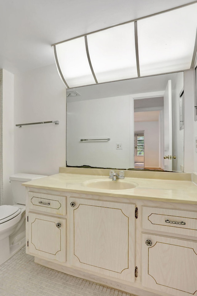 3034 Oakridge D 3034, Deerfield Beach, FL 33442 - bathroom with toilet, vanity, and tile patterned floors