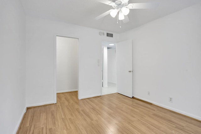 3034 Oakridge D 3034, Deerfield Beach, FL 33442 - unfurnished bedroom featuring light wood finished floors, baseboards, and a ceiling fan
