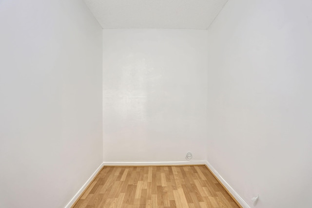 3034 Oakridge D 3034, Deerfield Beach, FL 33442 - empty room with light wood-type flooring and baseboards