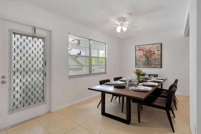 3034 Oakridge D 3034, Deerfield Beach, FL 33442 - dining space with a ceiling fan, a textured ceiling, light tile patterned flooring, and baseboards