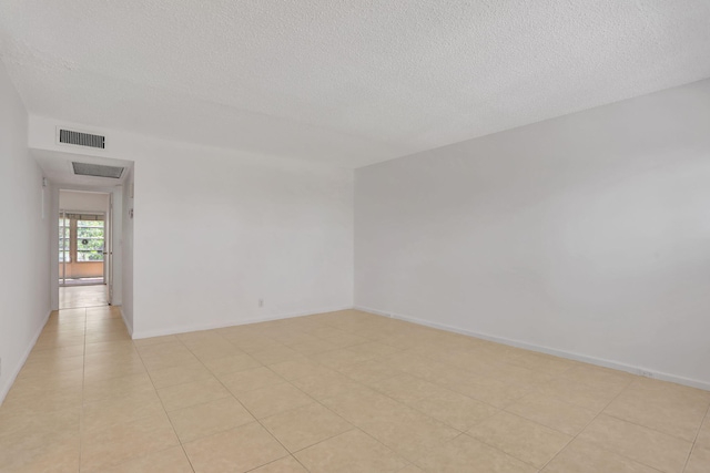 3034 Oakridge D 3034, Deerfield Beach, FL 33442 - empty room featuring a textured ceiling
