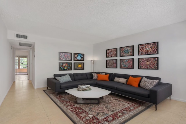 3034 Oakridge D 3034, Deerfield Beach, FL 33442 - living room with a textured ceiling, light tile patterned floors, and baseboards