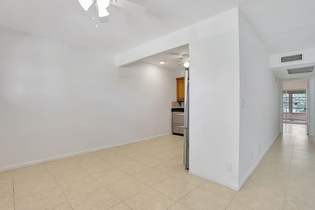 3034 Oakridge D 3034, Deerfield Beach, FL 33442 - unfurnished room featuring ceiling fan, light tile patterned flooring, and baseboards