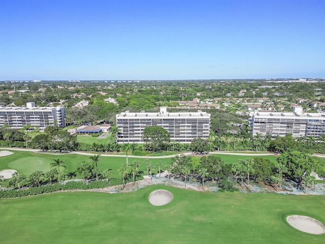 birds eye view of property featuring golf course view and a city view