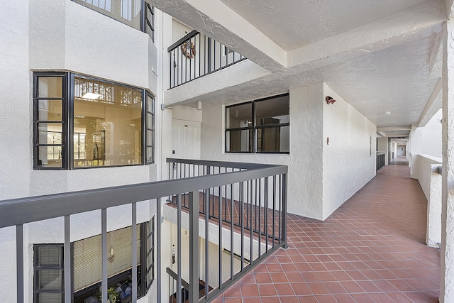 entrance to property featuring stucco siding