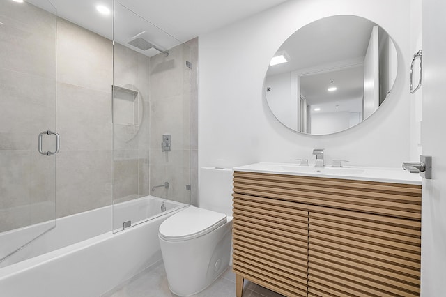 bathroom featuring toilet, vanity, and a combined bath / shower with rainfall shower