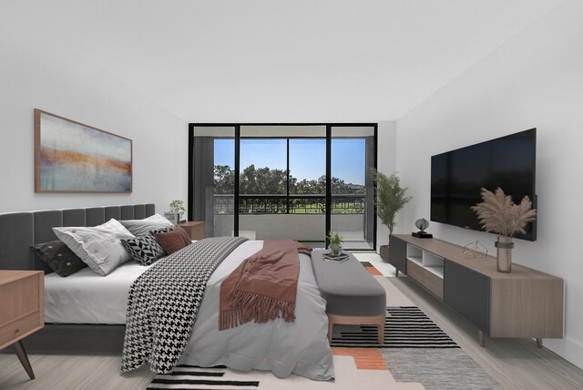bedroom with access to exterior, wood finished floors, and expansive windows