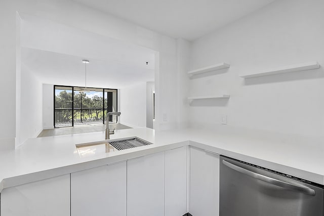 kitchen with open shelves, modern cabinets, light countertops, white cabinetry, and stainless steel dishwasher