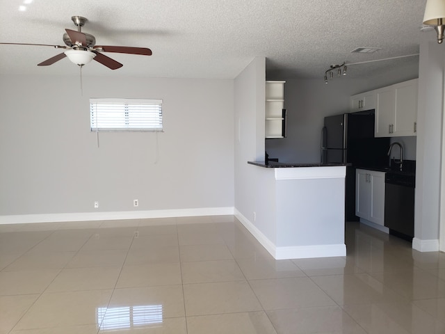 25 Crossings Cir Unit F, Boynton Beach, FL 33435 - kitchen featuring stainless steel dishwasher, freestanding refrigerator, dark countertops, light tile patterned flooring, and ceiling fan