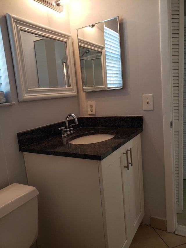 25 Crossings Cir Unit F, Boynton Beach, FL 33435 - bathroom with vanity, toilet, and tile patterned flooring