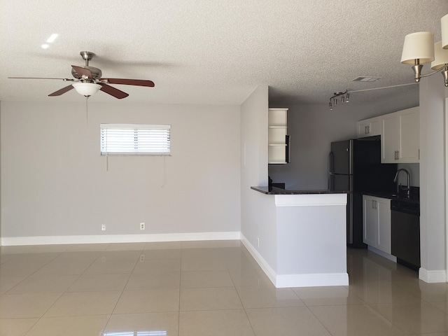 25 Crossings Cir Unit F, Boynton Beach, FL 33435 - kitchen featuring dishwasher, a ceiling fan, light tile patterned flooring, a sink, and a textured ceiling