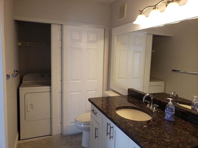 25 Crossings Cir Unit F, Boynton Beach, FL 33435 - bathroom with washer / dryer, vanity, toilet, and tile patterned floors