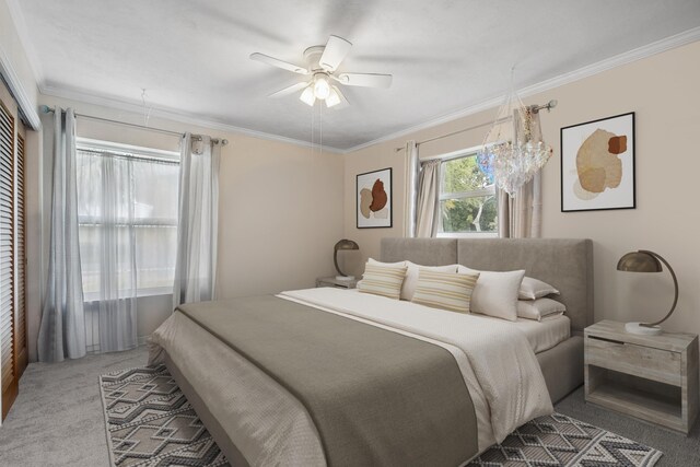 bedroom featuring ceiling fan, light colored carpet, and ornamental molding