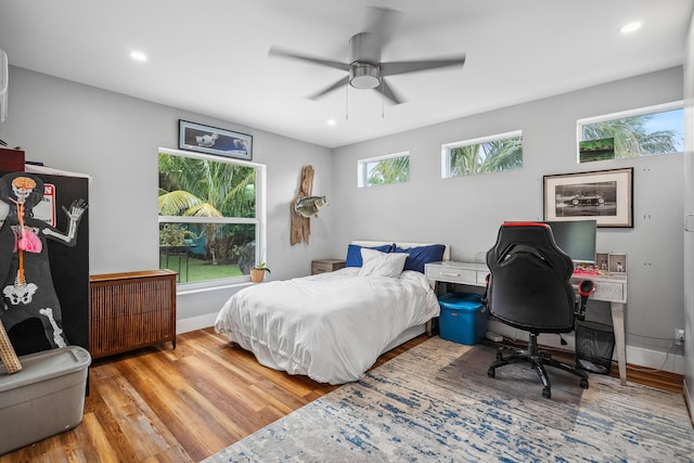 bedroom featuring baseboards, ceiling fan, recessed lighting, and wood finished floors