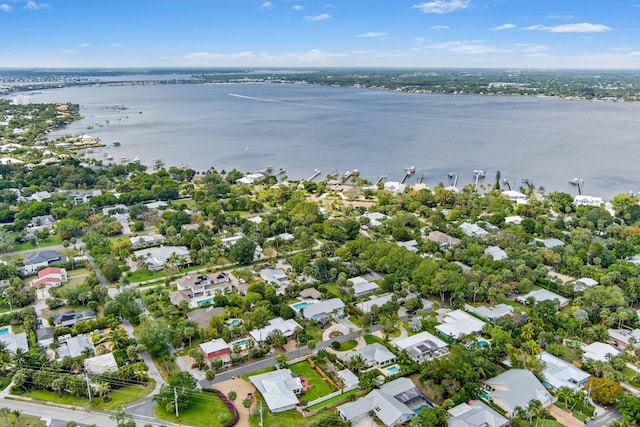 birds eye view of property featuring a water view and a residential view