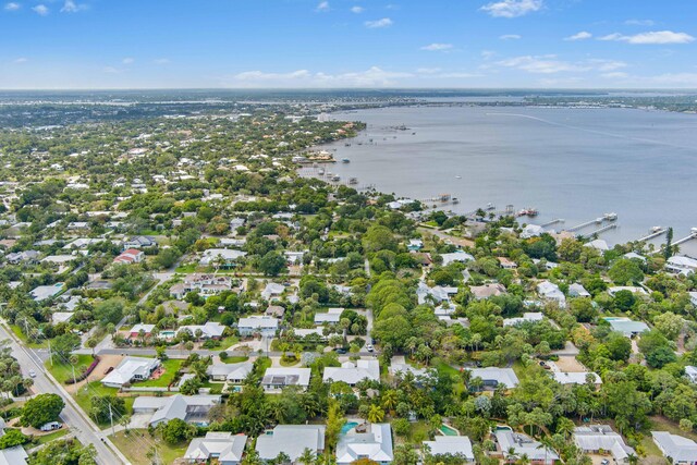 drone / aerial view with a water view and a residential view