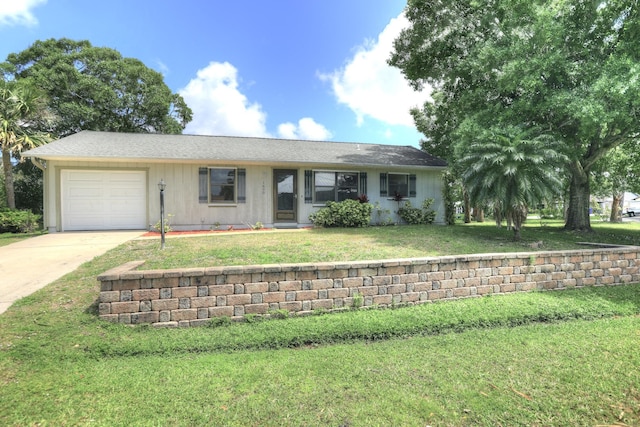1690 Seahouse St, Sebastian, FL 32958 - ranch-style home with a front lawn, a garage, and concrete driveway