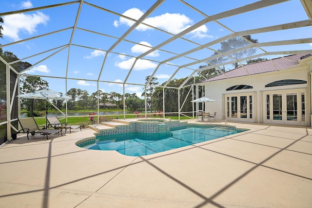 view of pool with a patio area, a pool with connected hot tub, french doors, and glass enclosure