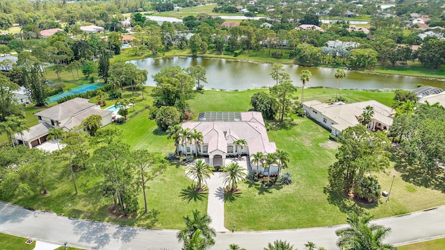 birds eye view of property with a water view