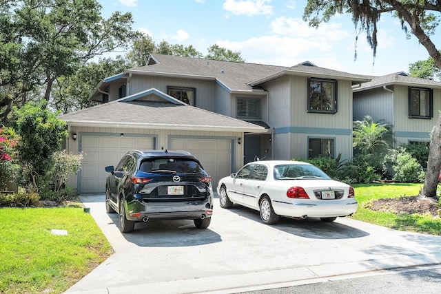 view of front facade featuring a garage, a front lawn, concrete driveway, and roof with shingles