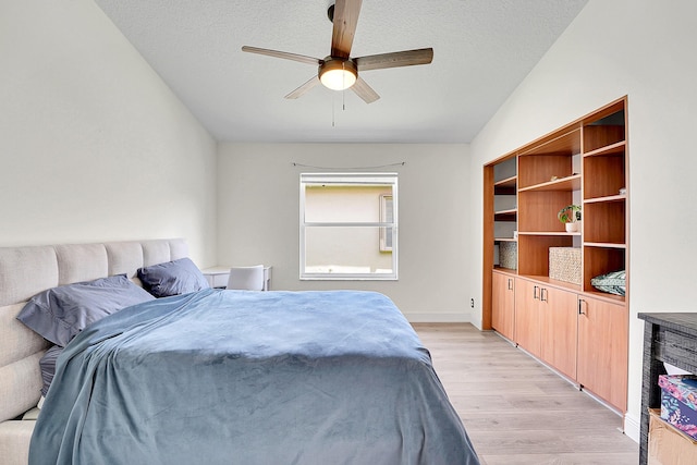 6298 Via Primo St, Lake Worth, FL 33467 - bedroom featuring light wood finished floors, vaulted ceiling, a ceiling fan, and baseboards