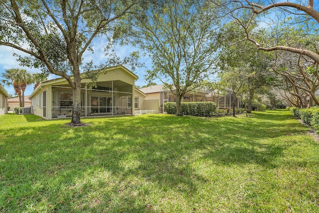 6298 Via Primo St, Lake Worth, FL 33467 - view of grassy yard featuring a sunroom and cooling unit