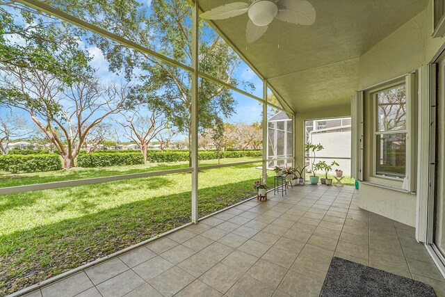 6298 Via Primo St, Lake Worth, FL 33467 - unfurnished sunroom featuring a ceiling fan