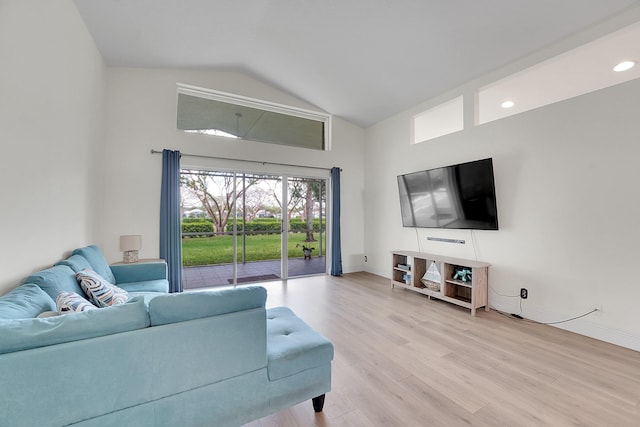 6298 Via Primo St, Lake Worth, FL 33467 - living area with high vaulted ceiling, light wood finished floors, and baseboards