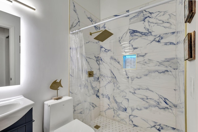 full bathroom with a stall shower, vanity, and toilet