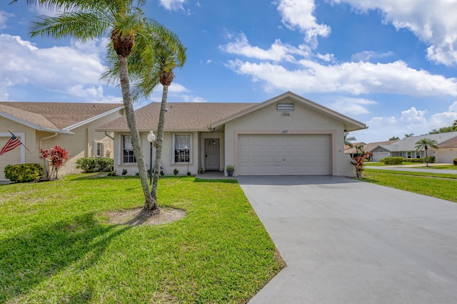 ranch-style home with stucco siding, an attached garage, driveway, and a front yard