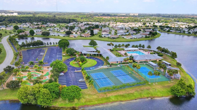 aerial view of residential area with a large body of water
