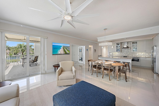 621 Bay Colony Drive S & Slip 13, Juno Beach, FL 33408 - dining room featuring light tile patterned flooring, crown molding, a ceiling fan, and baseboards