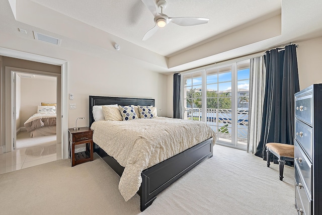 621 Bay Colony Drive S & Slip 13, Juno Beach, FL 33408 - bedroom featuring light colored carpet, access to outside, and ceiling fan
