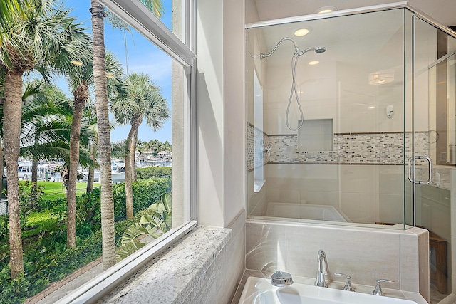 621 Bay Colony Drive S & Slip 13, Juno Beach, FL 33408 - bathroom with a stall shower, plenty of natural light, and a bath