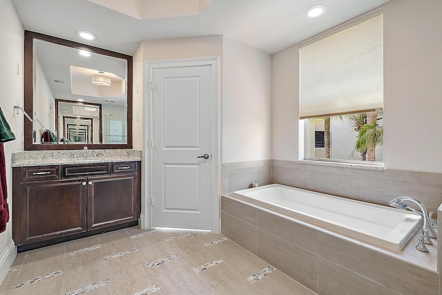 621 Bay Colony Drive S & Slip 13, Juno Beach, FL 33408 - full bathroom featuring a garden tub, vanity, and recessed lighting