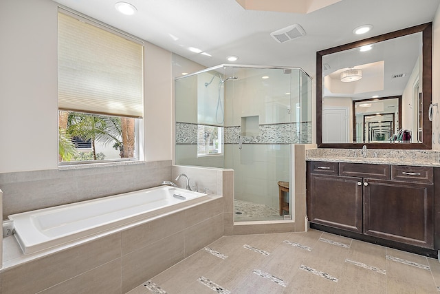 621 Bay Colony Drive S & Slip 13, Juno Beach, FL 33408 - bathroom featuring a garden tub, a stall shower, vanity, and recessed lighting