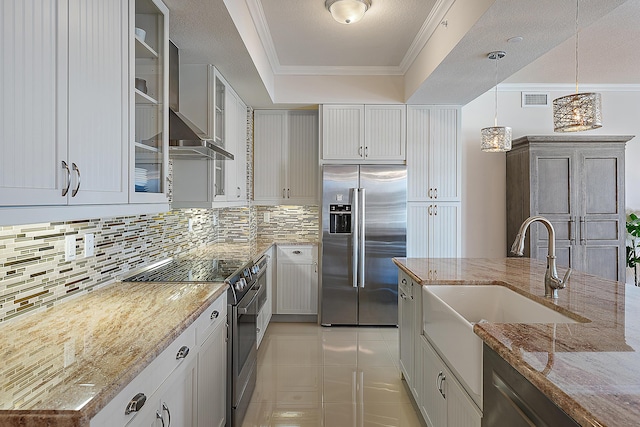 621 Bay Colony Drive S & Slip 13, Juno Beach, FL 33408 - kitchen featuring appliances with stainless steel finishes, wall chimney exhaust hood, a sink, decorative backsplash, and a tray ceiling