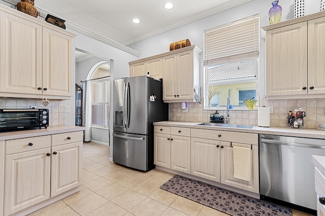 2111 Bellcrest Ct, Royal Palm Beach, FL 33411 - kitchen featuring appliances with stainless steel finishes, a sink, light countertops, ornamental molding, and recessed lighting