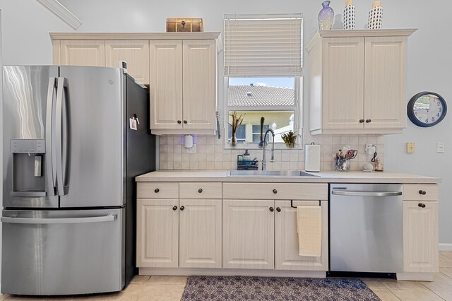 2111 Bellcrest Ct, Royal Palm Beach, FL 33411 - kitchen with stainless steel appliances, a sink, light tile patterned flooring, and light countertops