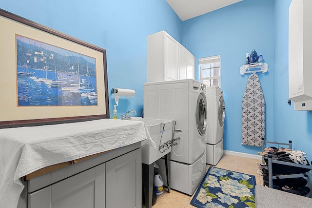 2111 Bellcrest Ct, Royal Palm Beach, FL 33411 - laundry room featuring cabinet space, washer and dryer, and light tile patterned flooring