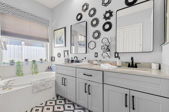 2111 Bellcrest Ct, Royal Palm Beach, FL 33411 - full bath featuring double vanity, a garden tub, and tile patterned flooring
