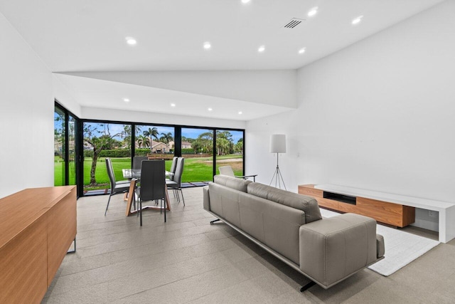 6878 Touchstone Cir, Palm Beach Gardens, FL 33418 - living room featuring lofted ceiling, visible vents, and recessed lighting