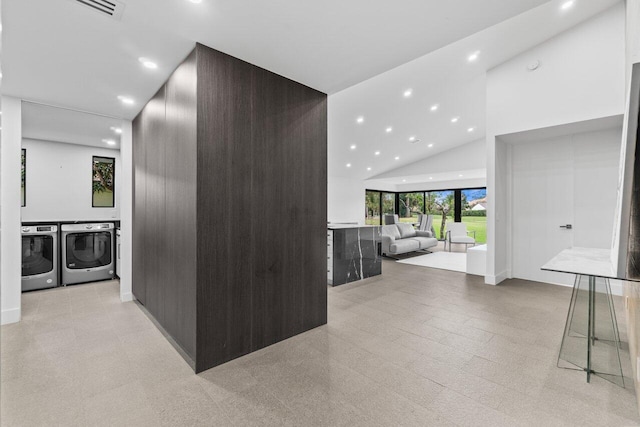 6878 Touchstone Cir, Palm Beach Gardens, FL 33418 - hall featuring washer and clothes dryer, high vaulted ceiling, visible vents, and recessed lighting