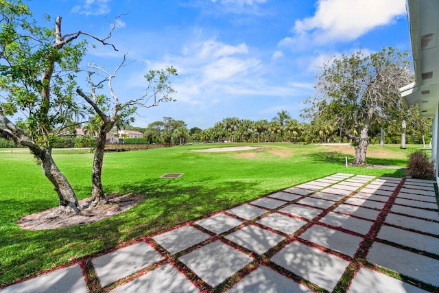 6878 Touchstone Cir, Palm Beach Gardens, FL 33418 - surrounding community with a yard, a patio area, and view of golf course