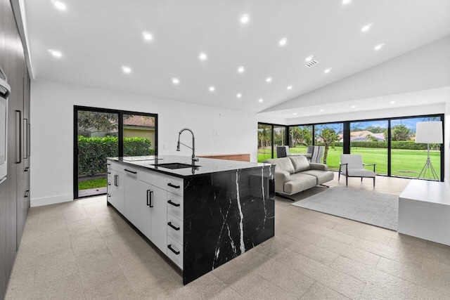 6878 Touchstone Cir, Palm Beach Gardens, FL 33418 - kitchen featuring recessed lighting, modern cabinets, a sink, a large island, and white cabinets