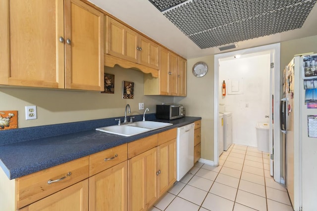 431 Jupiter Lakes Blvd Unit 2113C, Jupiter, FL 33458 - kitchen with dark countertops, white appliances, separate washer and dryer, a sink, and light tile patterned floors