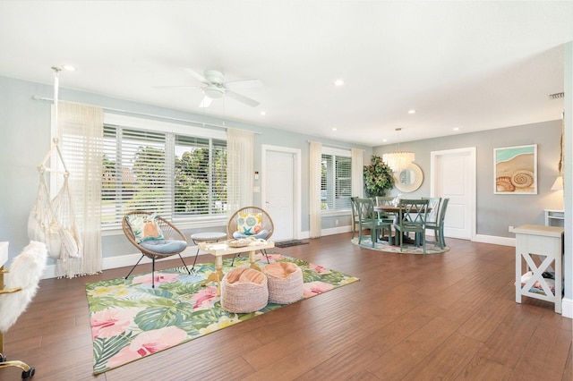dining area with recessed lighting, wood finished floors, baseboards, and a notable chandelier