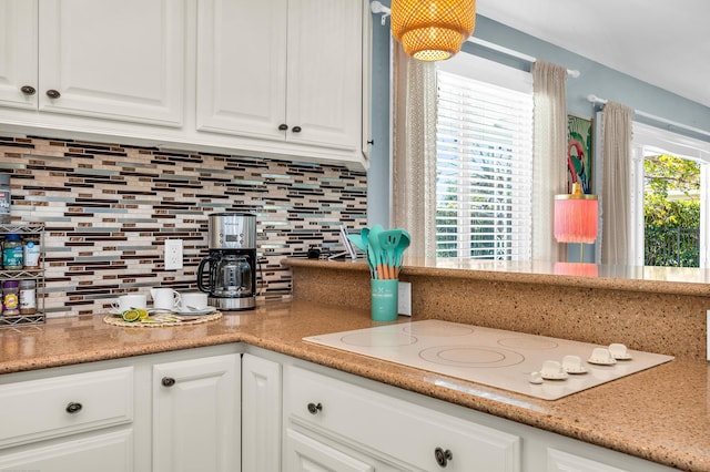 kitchen featuring tasteful backsplash, wood counters, white appliances, glass insert cabinets, and light wood finished floors