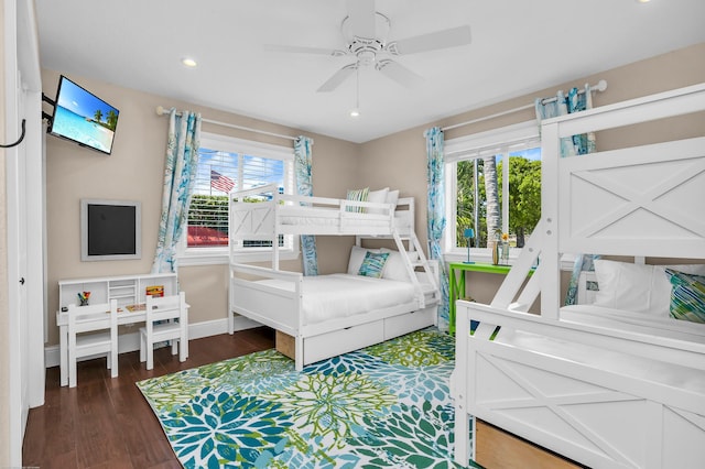 bedroom featuring baseboards, a ceiling fan, wood finished floors, and recessed lighting